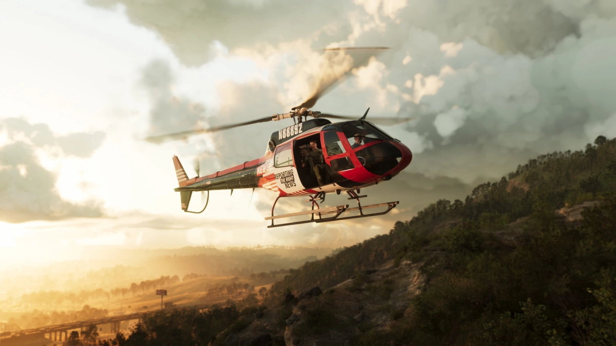 A news helicopter flying over a tree-filled ridge in Mount Kalaga National Park. A news helicopter flying over a tree-filled ridge in Mount Kalaga National Park.