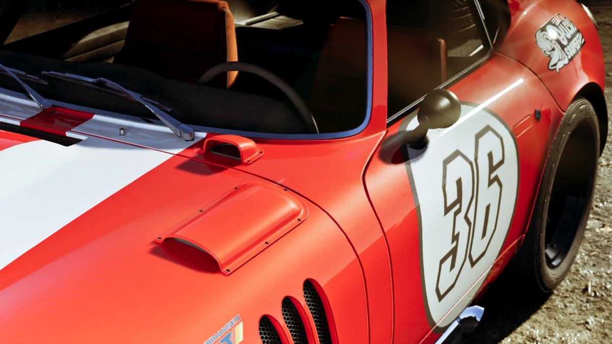Zoomed in side view of a classic red sports car with a racing livery that has the number 36 on the door panel.